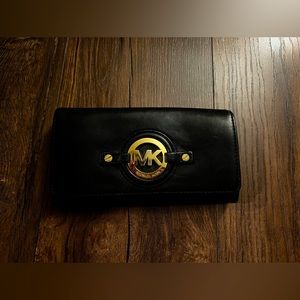 Women’s Michael Kors Black with Gold Hardware Leather Wallet.